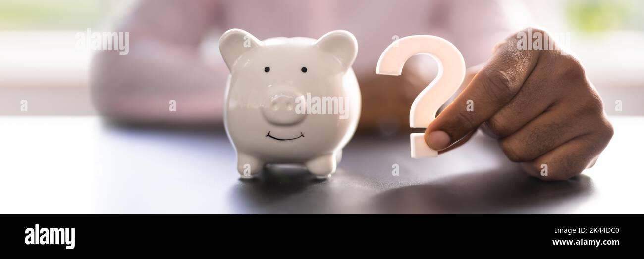 Piggy Bank Question Mark. Money Doubt. Investment Queries Stock Photo