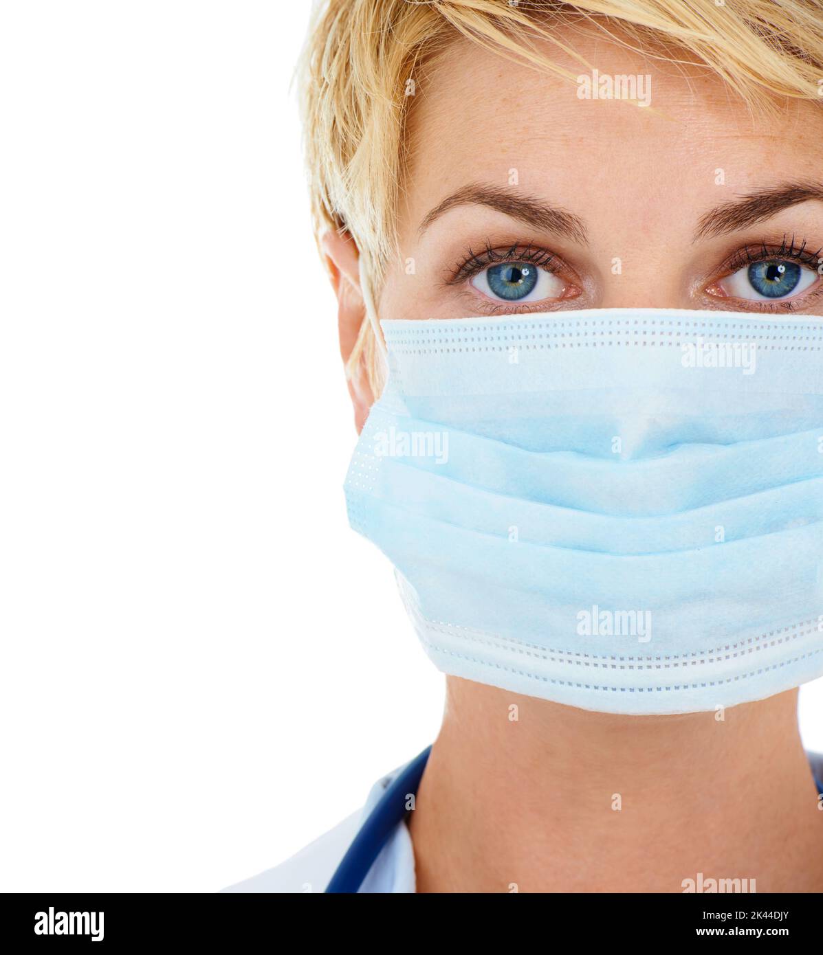 Keeping infectious diseases where they belong. Closeup of a young female doctor wearing a mask. Stock Photo