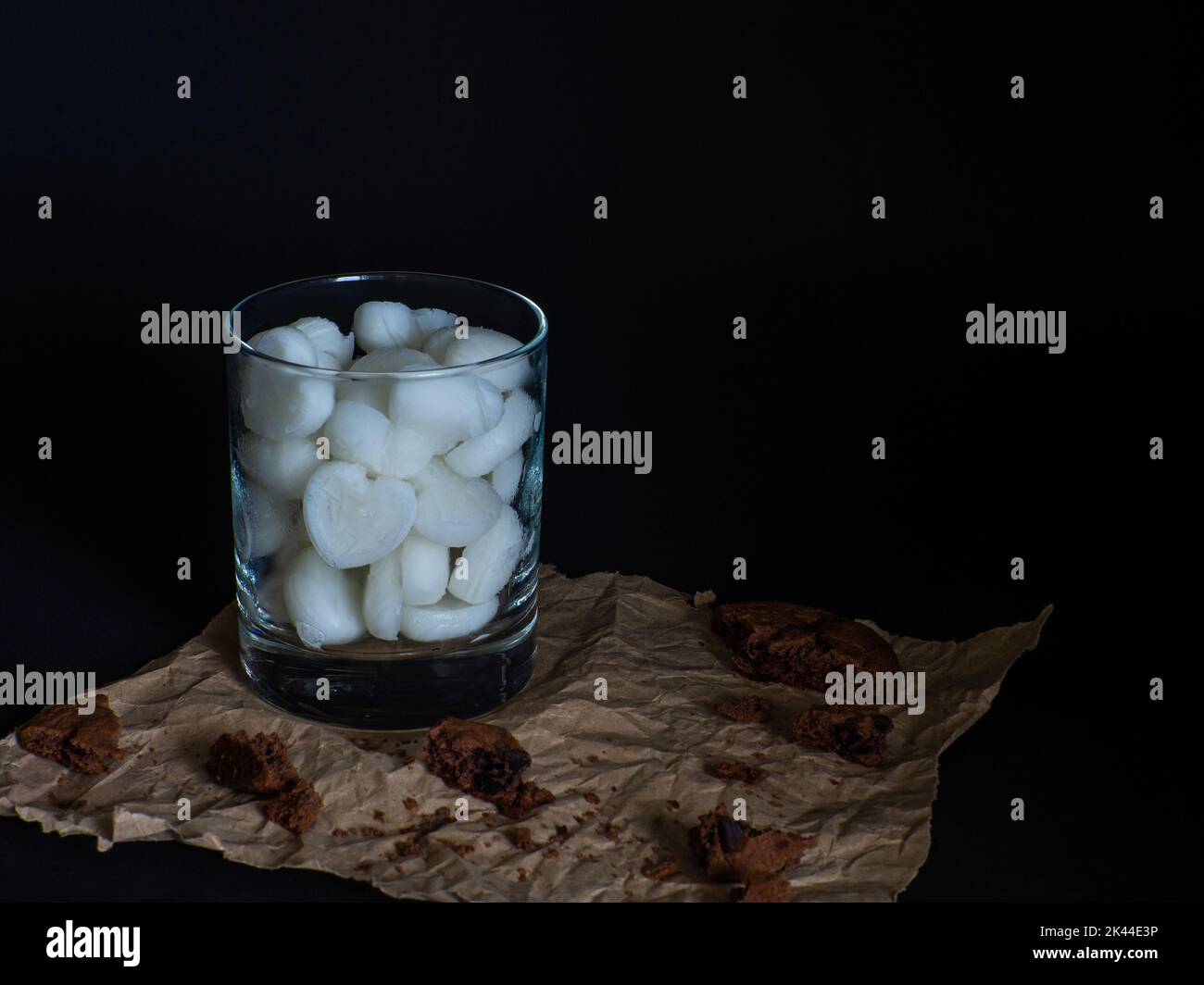 Ice cubes made from milk in heart shape in glass Stock Photo Alamy