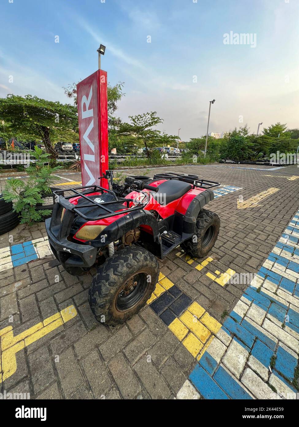 ATV awd quadbike motorcycle and cloudscape sky background. Offroad adventure trip . Extreme sport activity. Bekasi, Indonesia, September 30, 2022 Stock Photo