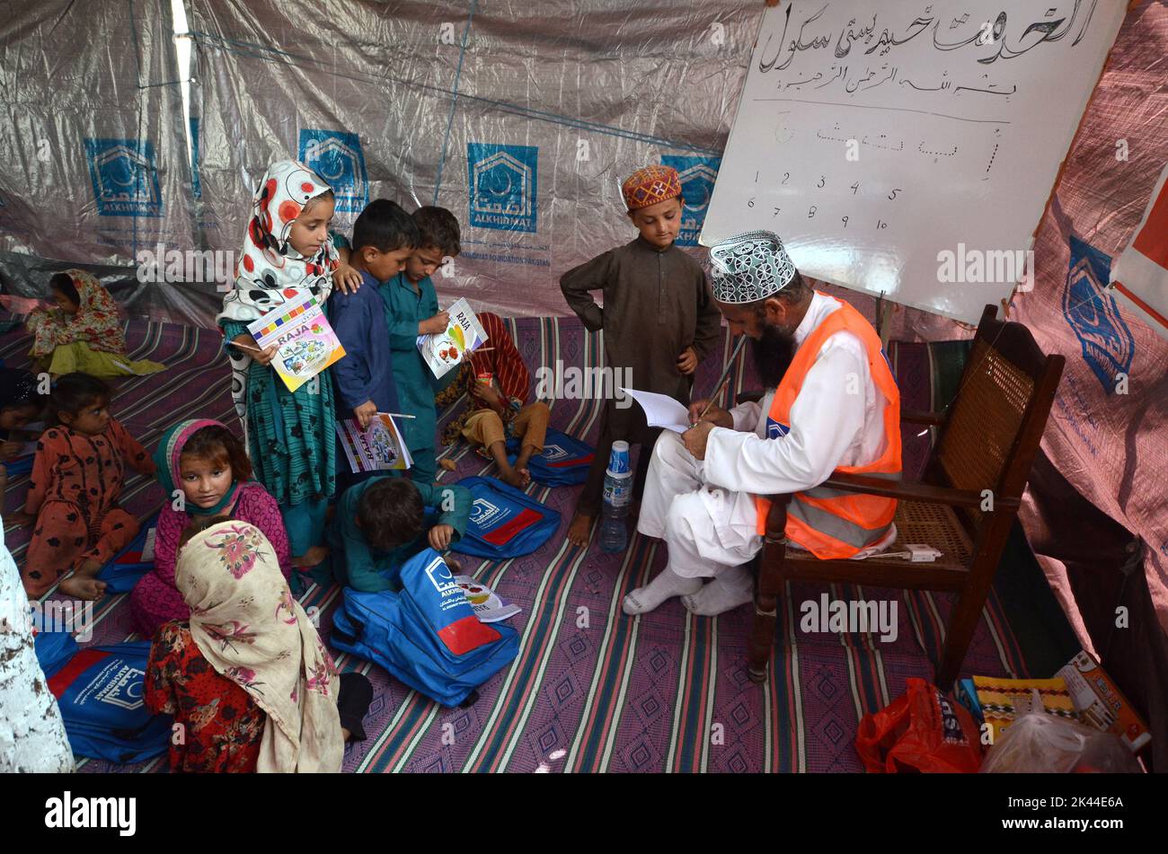 Peshawar, Khyber Pakhtunkhwa, Pakistan. 27th Sep, 2022. Al-Khidmat Foundation (AKF) established a tent village for flood-affected Afghan refugees at Hassan Khel, district Charsadda. The houses of 180 Afghan refugees residing in Hassan Khel an adjacent locality of Sar Daryab were destroyed in the recent flood. (Credit Image: © Hussain Ali/Pacific Press via ZUMA Press Wire) Stock Photo
