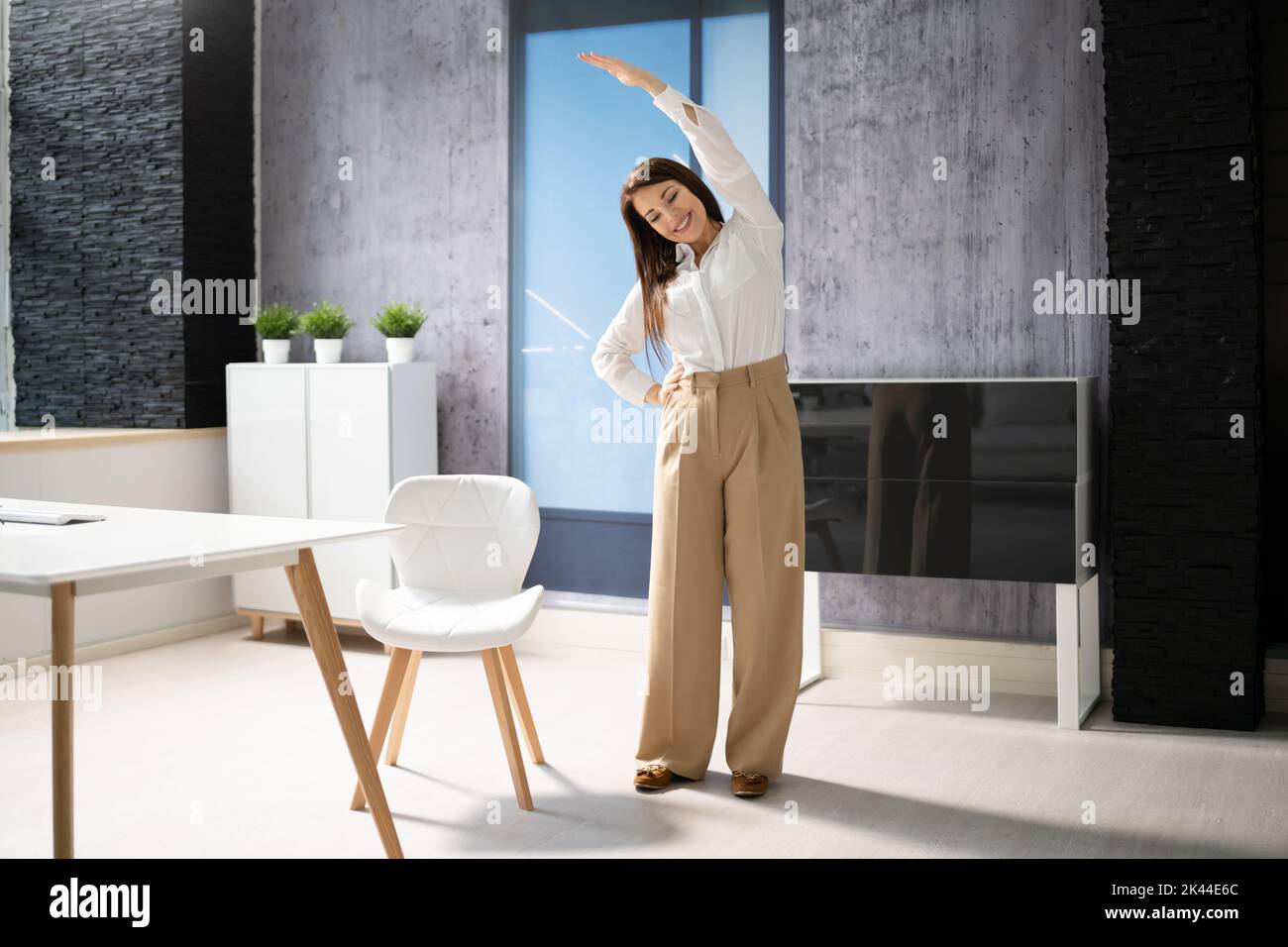 Stretching Office Workout. Desk Stretch Exercise At Workplace Stock Photo