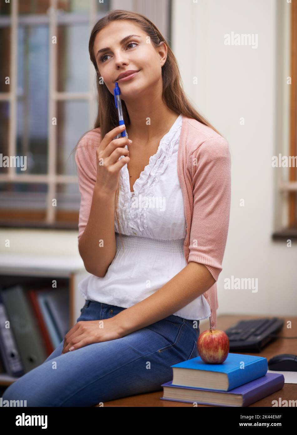 Teacher sitting at her desk in her office hi-res stock photography and ...