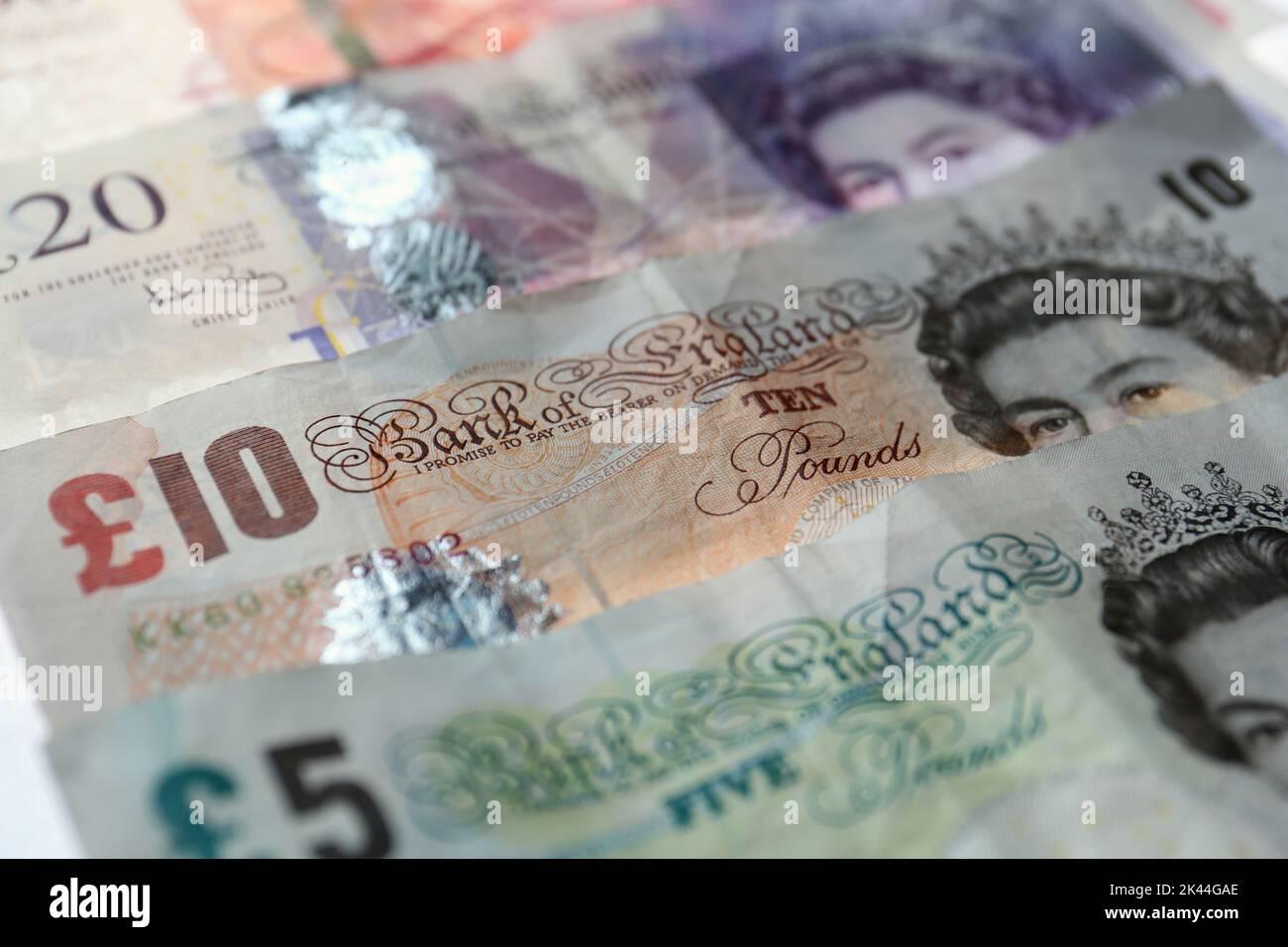 File photo dated 07/11/14 of fifty, twenty, ten, and five pound paper notes, as Friday is the last day that people can use the Bank of England's paper £20 and £50 notes in shops or to pay businesses. Stock Photo