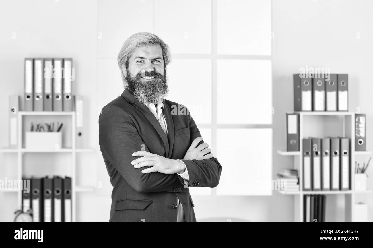 sense of self-worth. happy entrepreneur in modern office. business success. successful bearded ceo in jacket. confident man manager a workplace Stock Photo