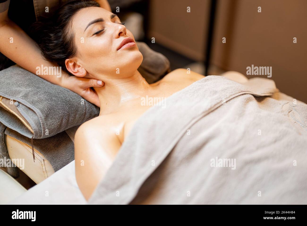 Woman receiving relaxation neck massage Stock Photo