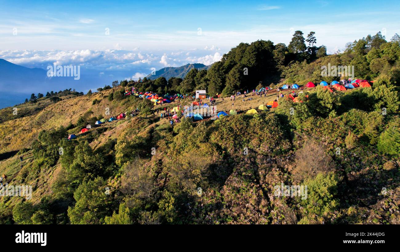 Aerial view of beauty mountain peaks Prau Dieng, Central Java and the climbers and tent. Wonosobo, Indonesia, September 30, 2022 Stock Photo