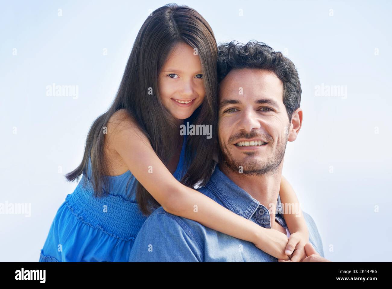 Portrait of father and daughter bond. Outdoor portrait of a smiling father and daughter. Stock Photo