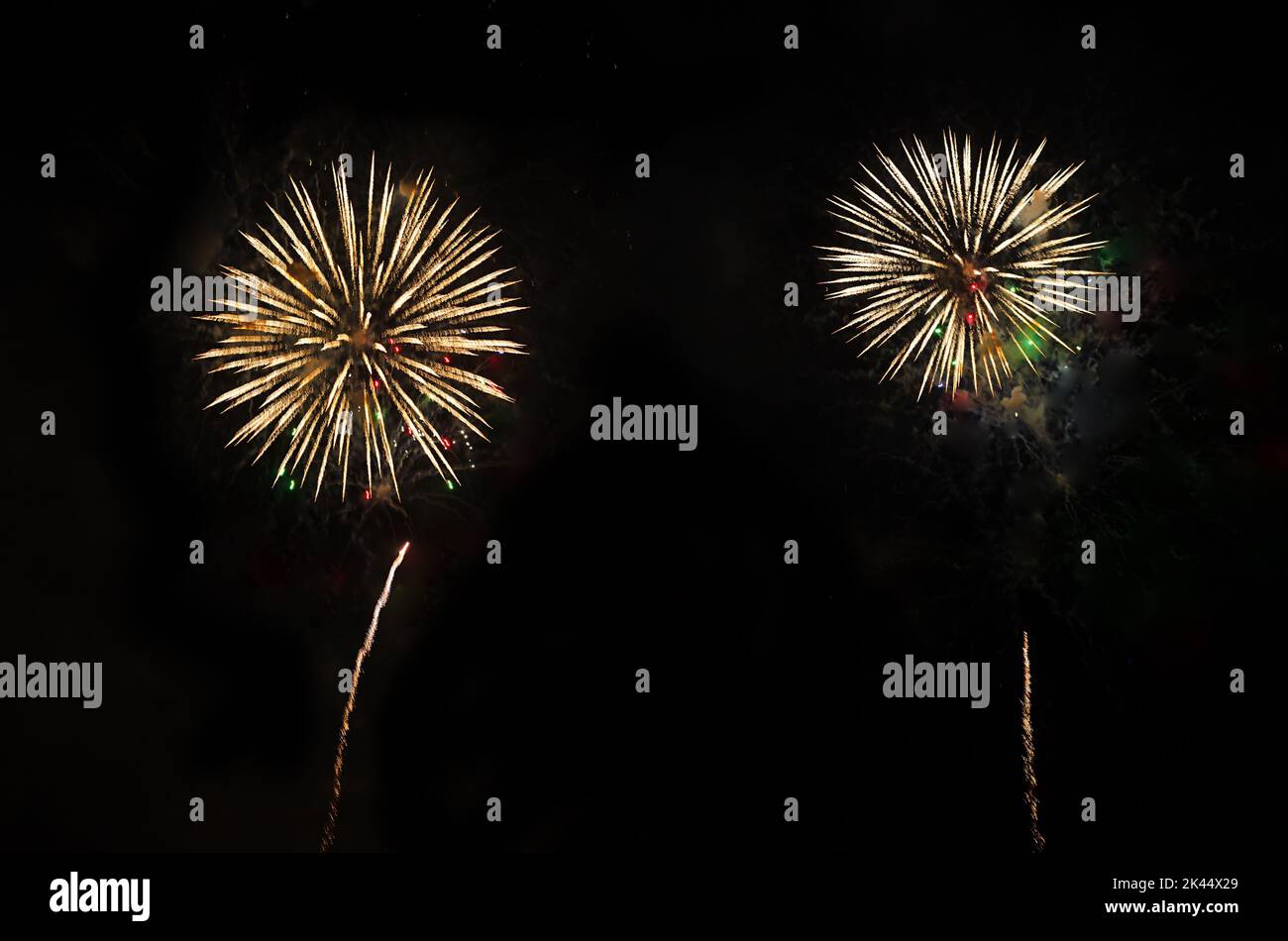 Two fireworks on night sky Stock Photo