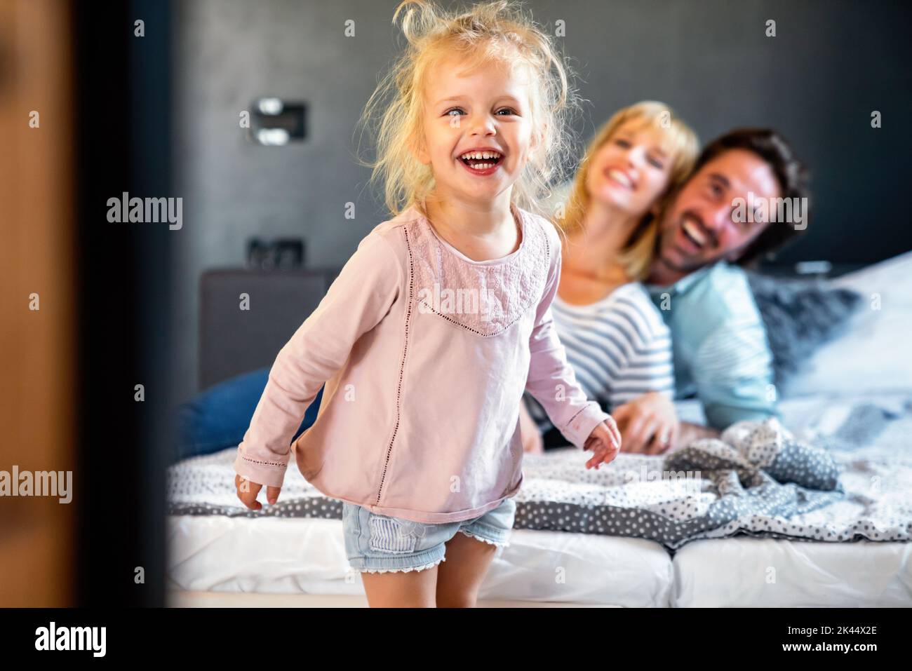 Young family being playful at home. People parent child fun happiness concept. Stock Photo