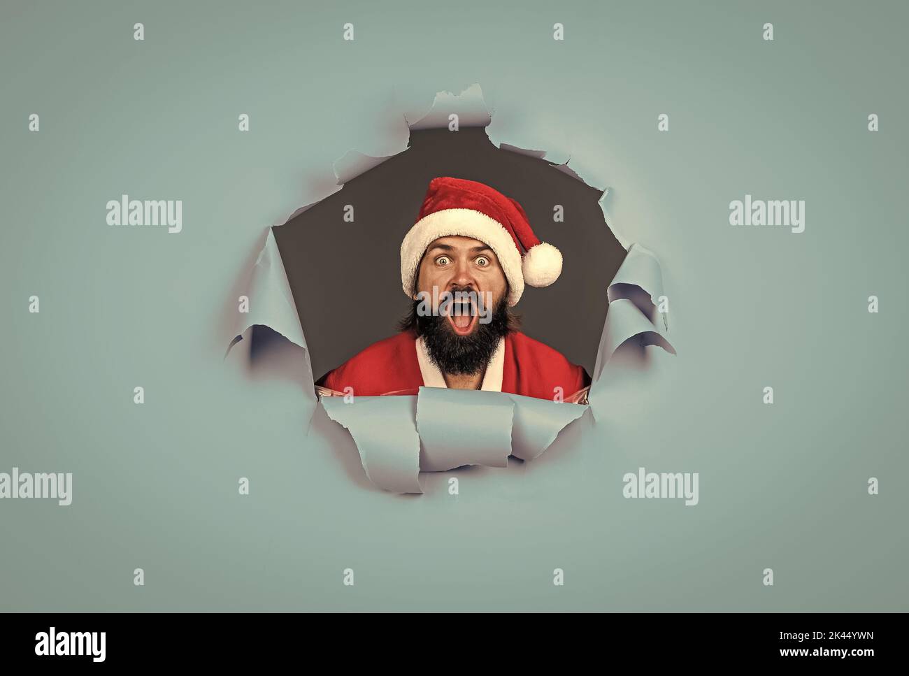 santa claus bearded man wish happy new year and merry christmas holiday ready to celebrate winter party with fun and joy full of xmas presents and Stock Photo