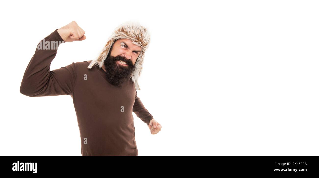angry brutal hipster with beard in earflape hat isolated on white background, anger Stock Photo