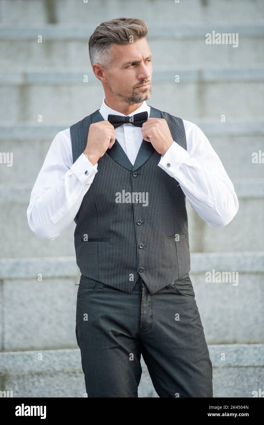 adult elegant man in bowtie. grizzled man in formalwear. tux man bridegroom Stock Photo