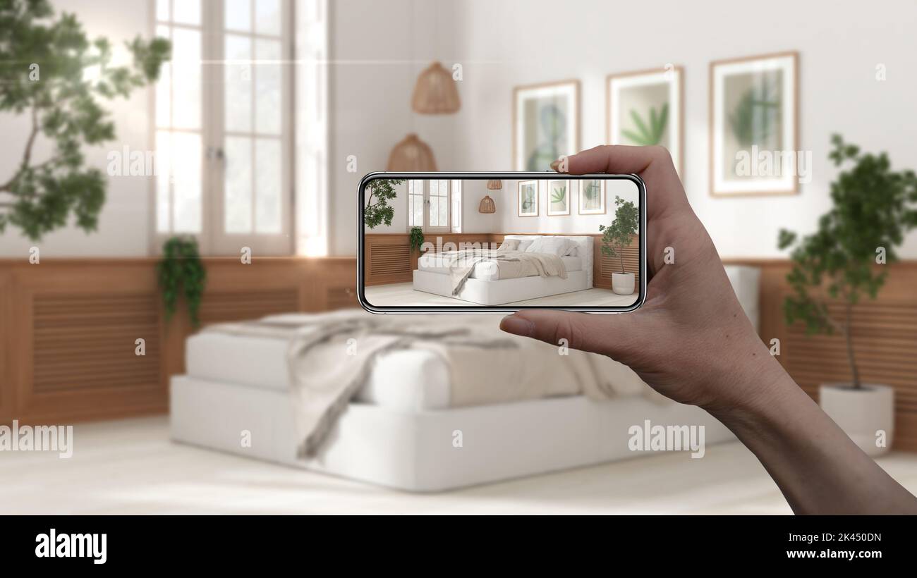 Hand holding smart phone, AR application, simulate furniture and ...