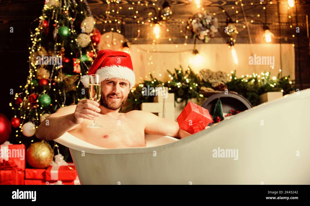 Time to relax. best xmas present. christmas spa. macho drink champagne after party. happy new year gift. erotic wish. feel desire. muscular man relax Stock Photo