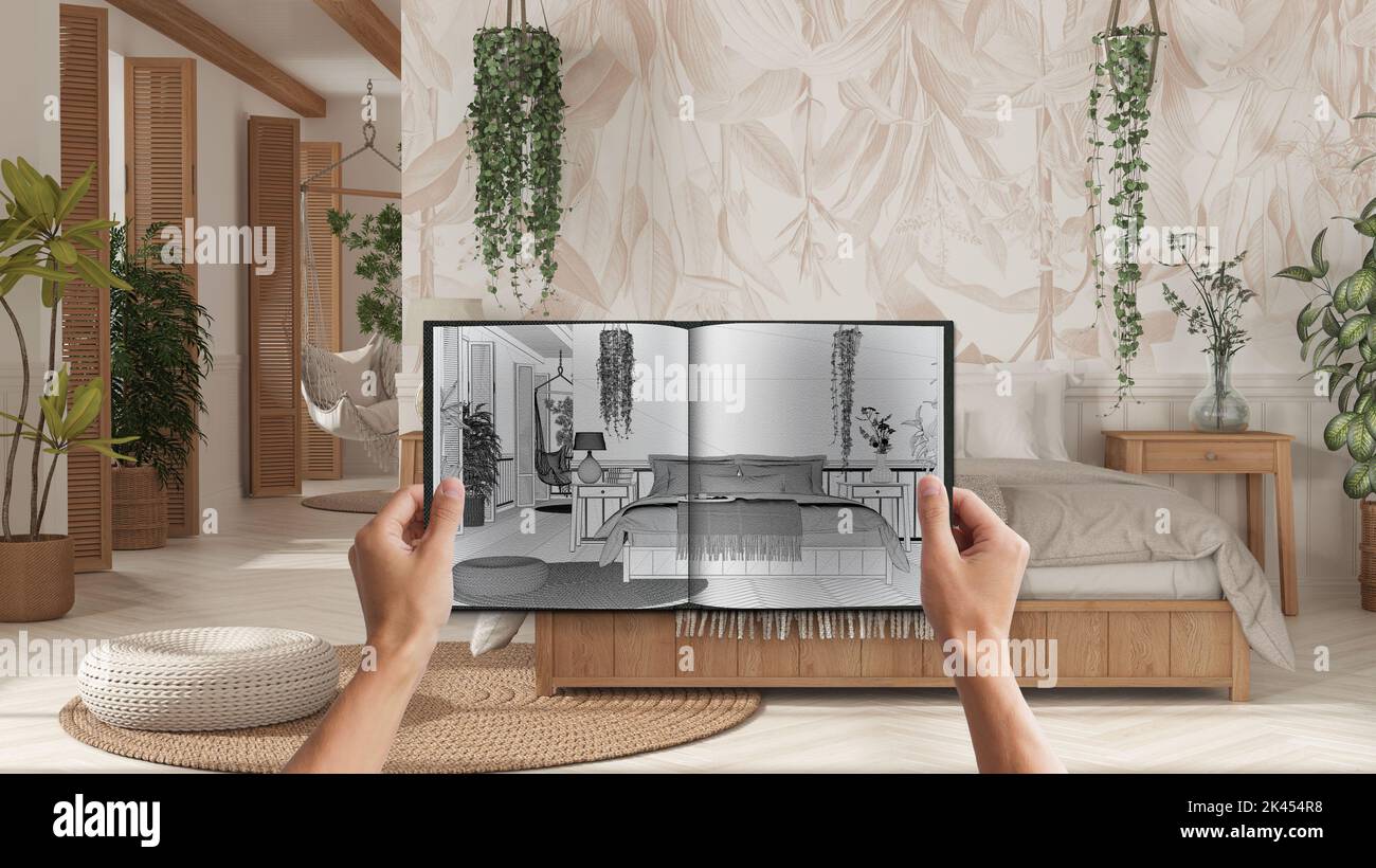 Hands holding notepad with boho style bedroom blueprint sketch or ...