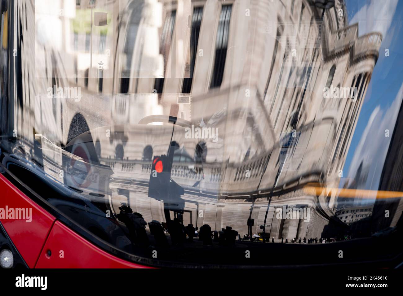 The Bank of England is seen reflected in the windscreen of a bus during Prime Minister Liz Truss and her Chancellor Kwasi Kwarteng's economic crisis, in the City of London, the capital's financial district, on 29th September 2022, in the City of London, England. Stock Photo