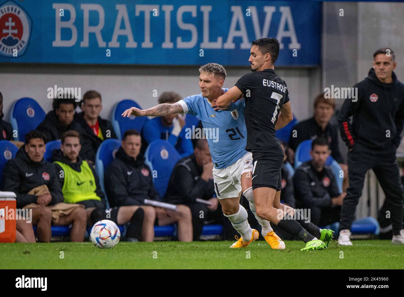 BRATISLAVA, SLOVAKIA - SEPTEMBER 27: Guillermo Varela of Uruguay and Stephen Eustaquio during the international friendly match between Uruguay and Can Stock Photo