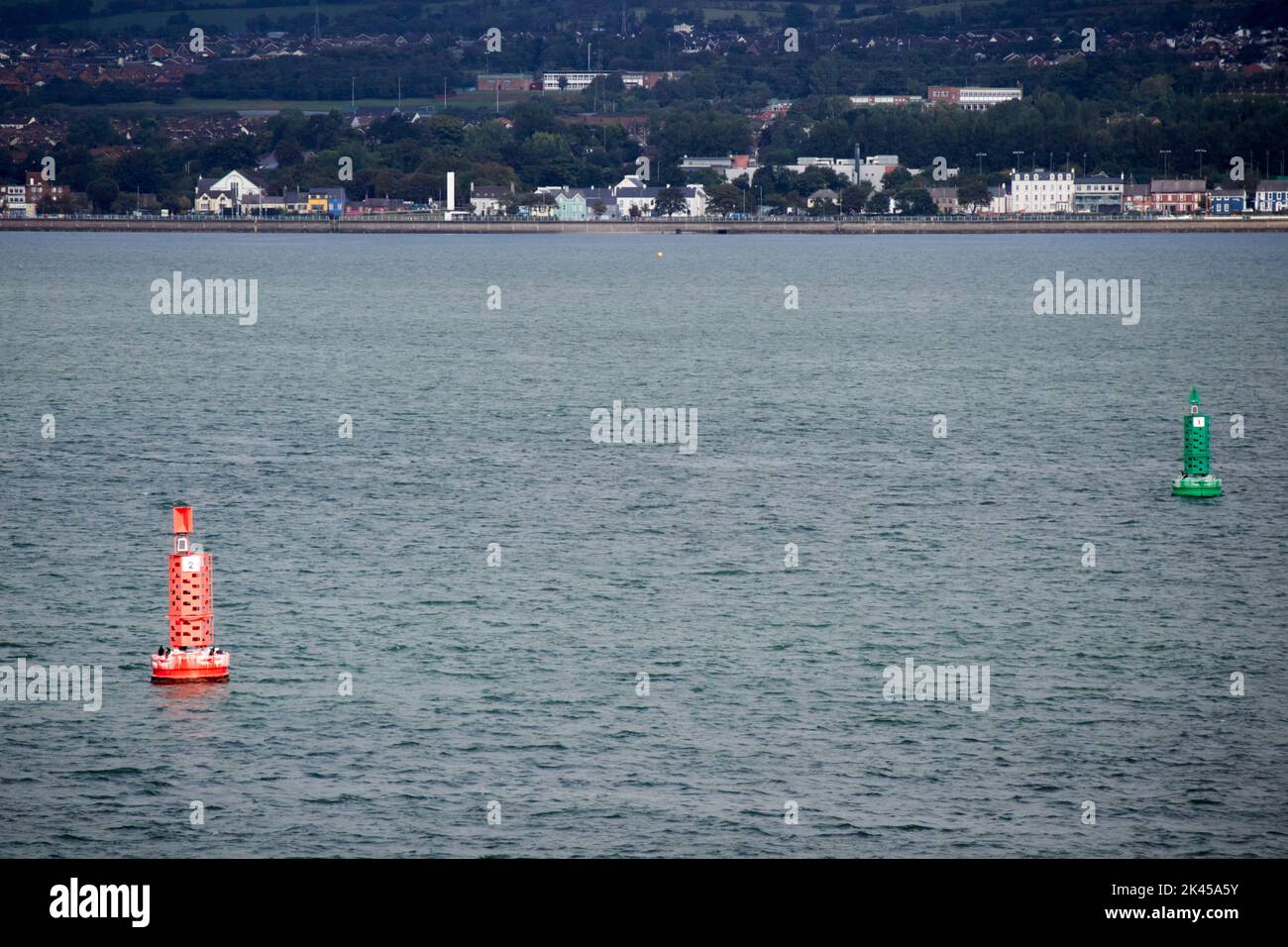 green and red navigation markers in the shipping lanes channel in the middle of belfast lough northern ireland Stock Photo
