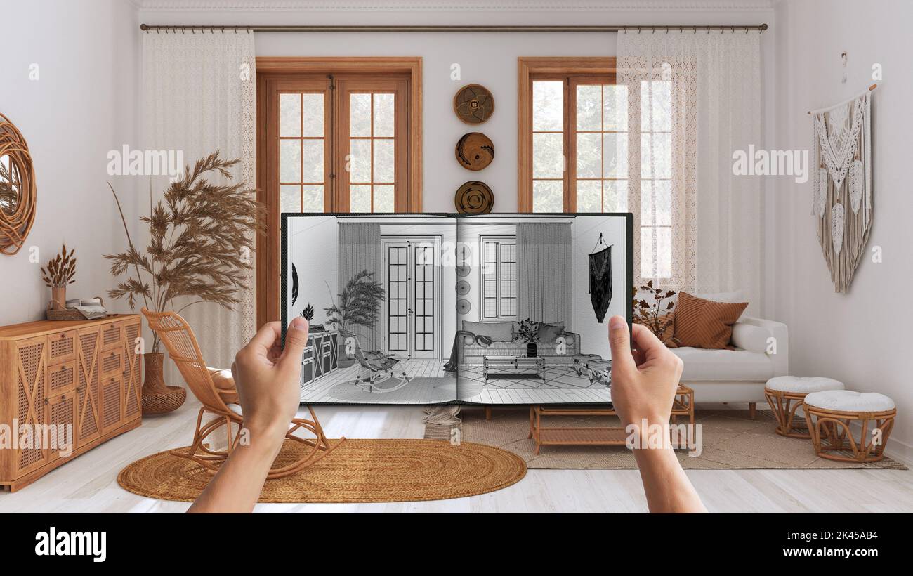 Hands holding notepad with boho living room design blueprint sketch or ...