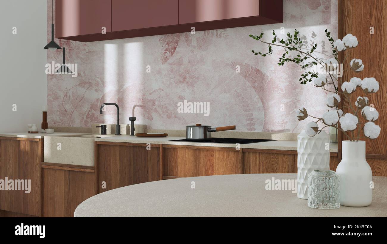 Japandi trendy wooden kitchen and dining room in white and red tones. Close up on table with cotton flowers, wallpaper, cabinets and marble top. Minim Stock Photo