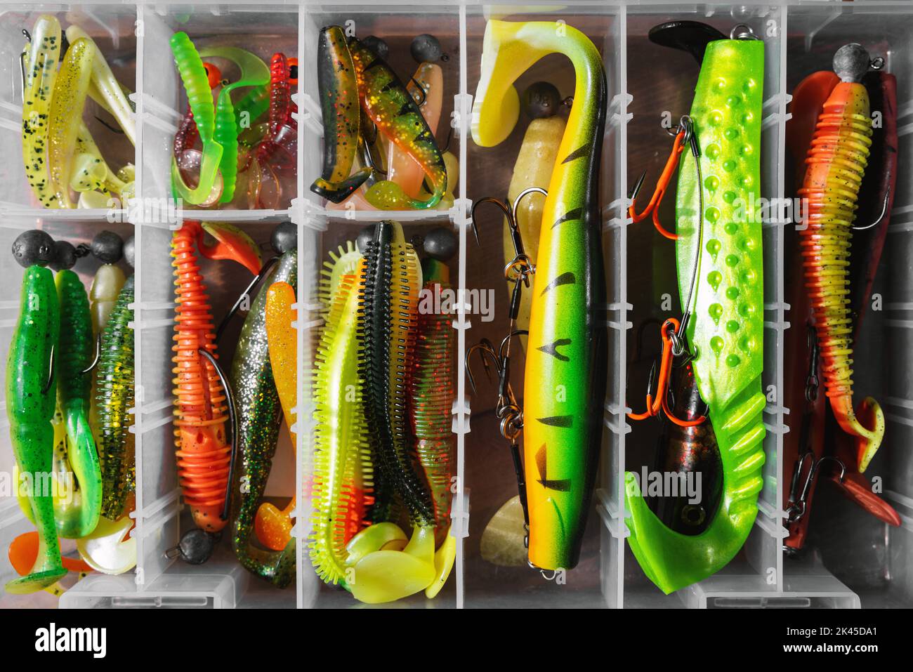 colorful silicone lures. fishing tackle box Stock Photo