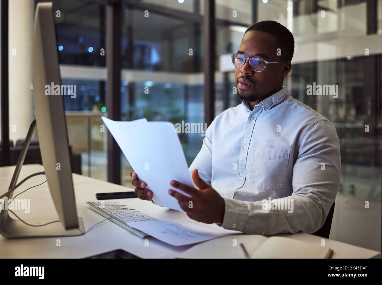 Night worker, black businessman and paperwork planning, reading