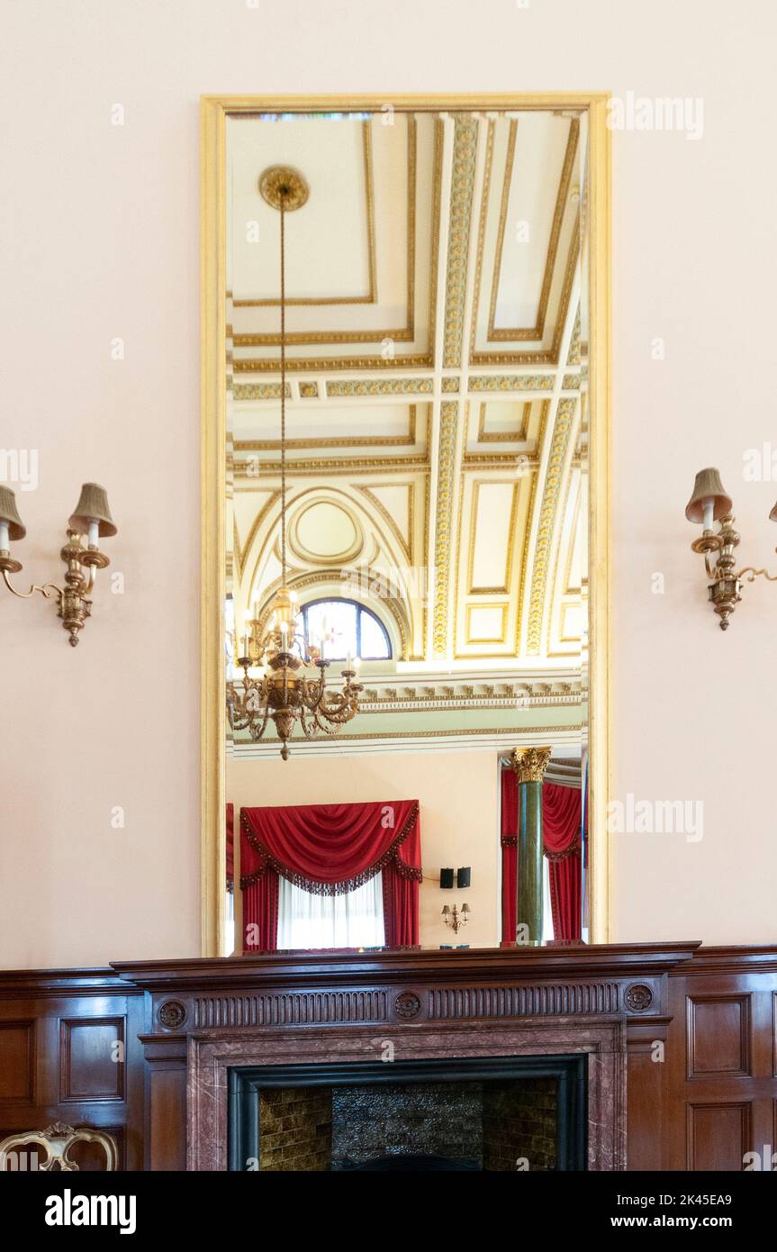 Mirror above the fireplace in the ballroom of the Harbour Commissioner's building, Belfast. Stock Photo