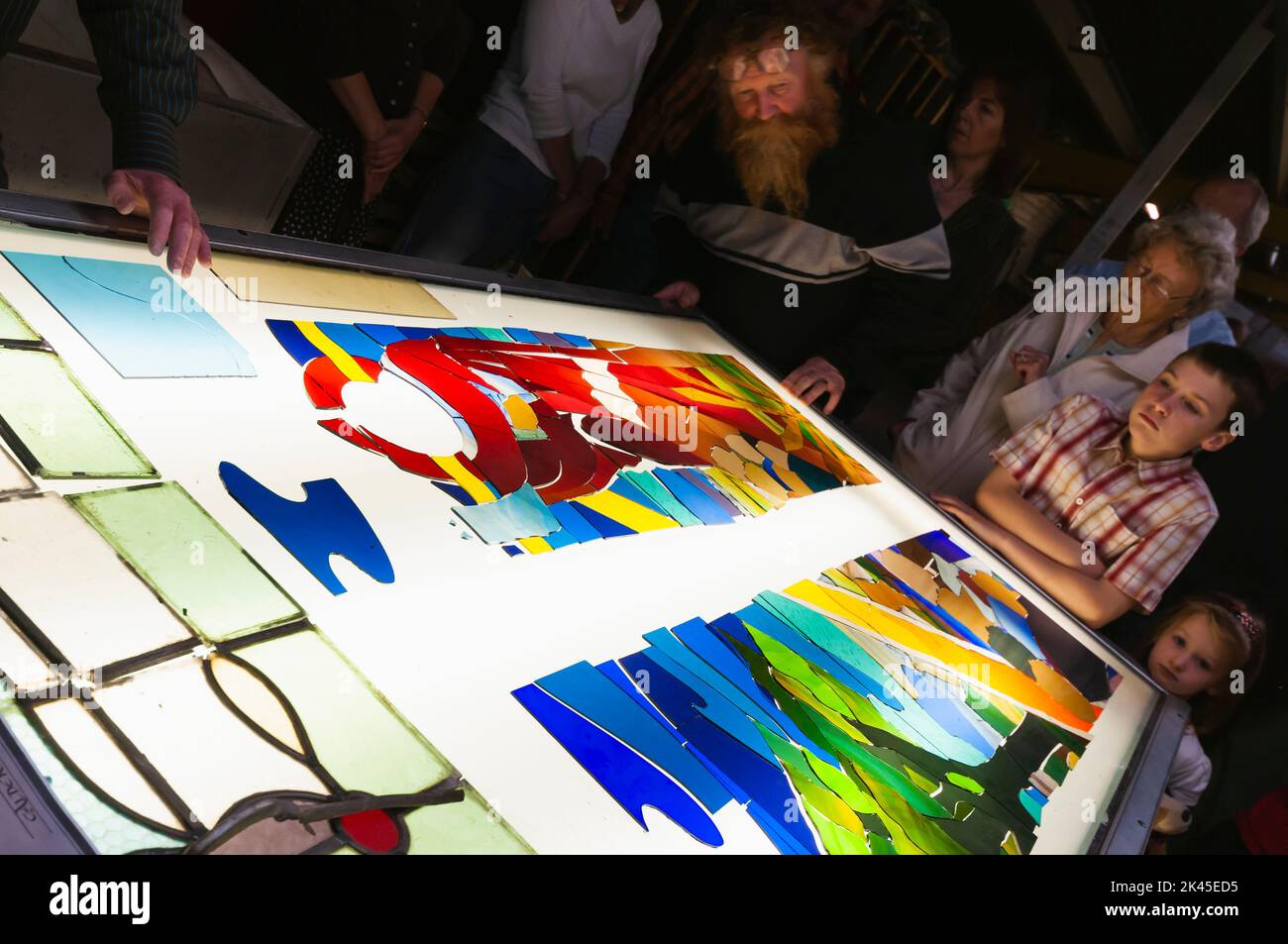 Visitors look on as they are given a demonstration on how to build