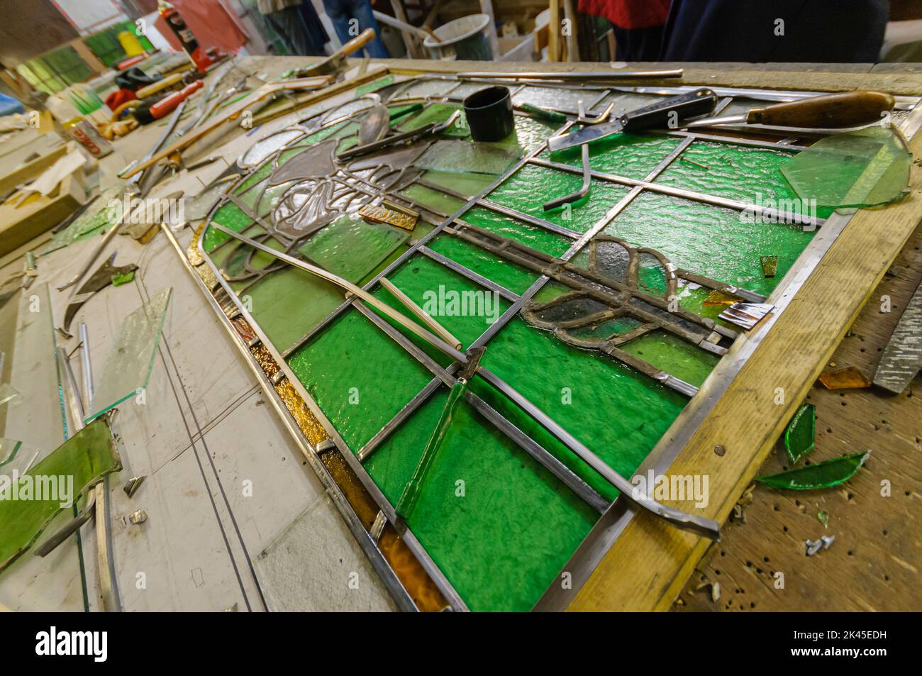 An old stained glass window mid restoration Stock Photo Alamy