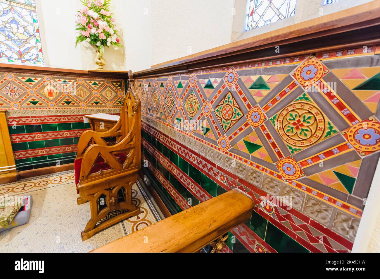 Ornate, old wall tiles inside a church. Stock Photo