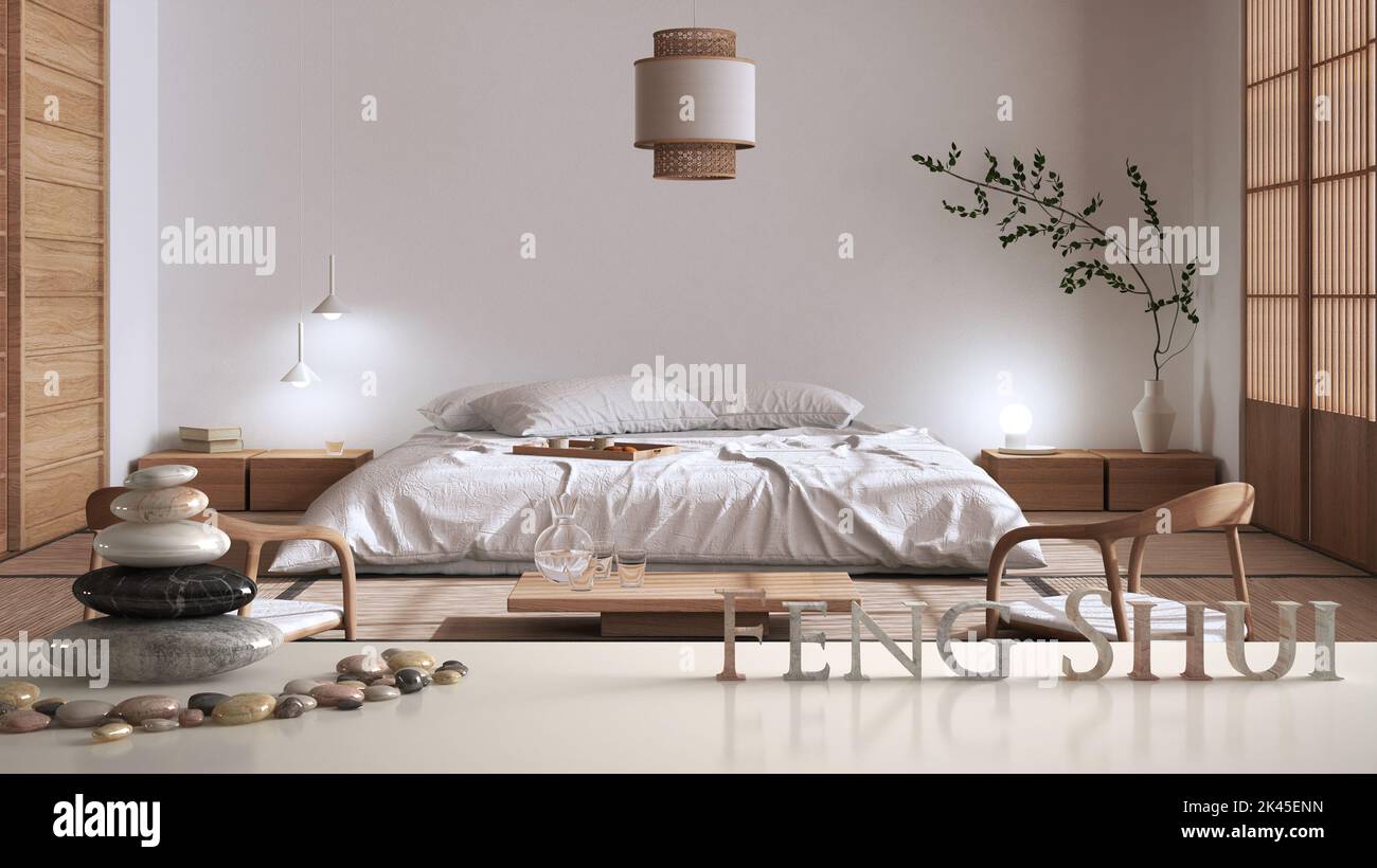 White table shelf with pebble balance and 3d letters making the word feng shui over modern