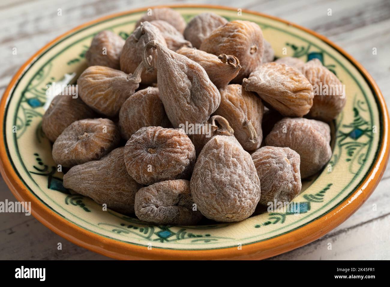 Dish with sweet dried small spanish figs close up Stock Photo