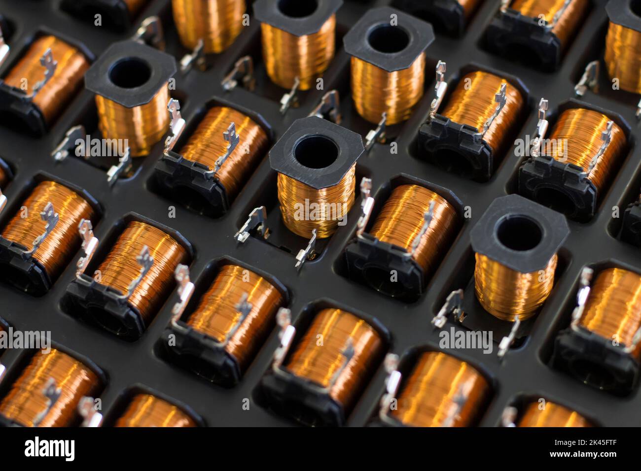Close up on industrial coils made of copper Stock Photo - Alamy