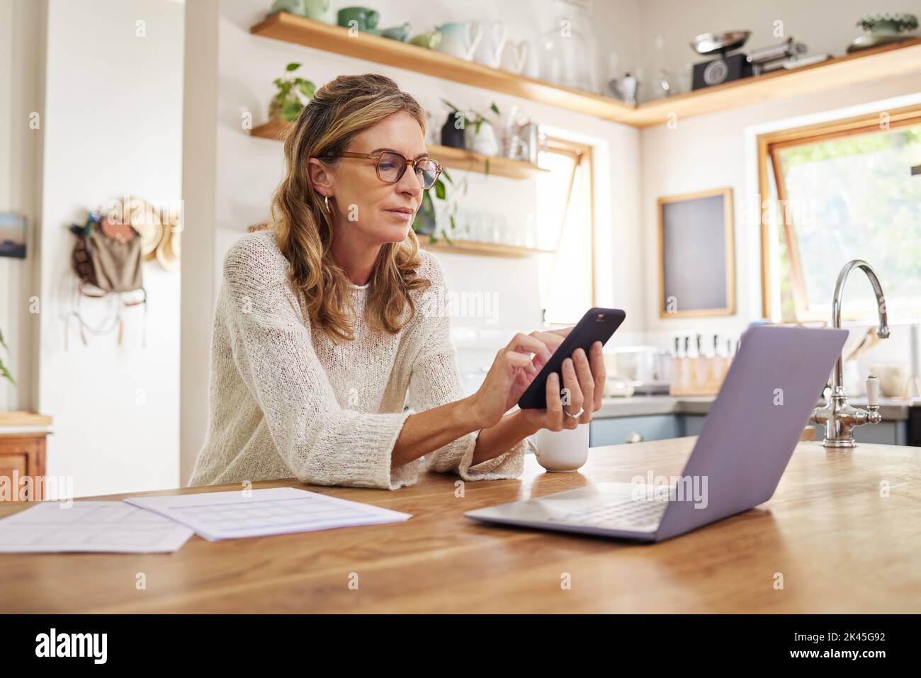 Mature woman paperwork thinking hi-res stock photography and images - Alamy