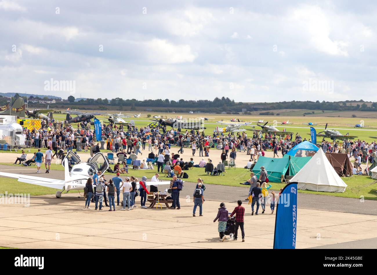 Duxford airshow - Crowds of visitors at the Battle of Britain Airshow UK; Imperial War Museum, Duxford, Cambridgeshire UK Stock Photo