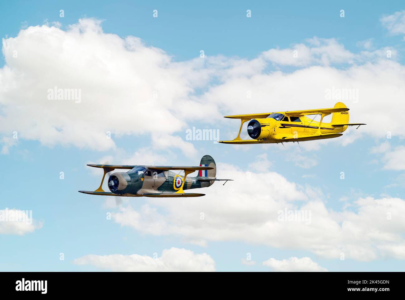 World War 2 plane; Beech Model 17 Staggerwing plane- two Beech Staggerwings flying; a 1930s biplane used in WW2 Stock Photo