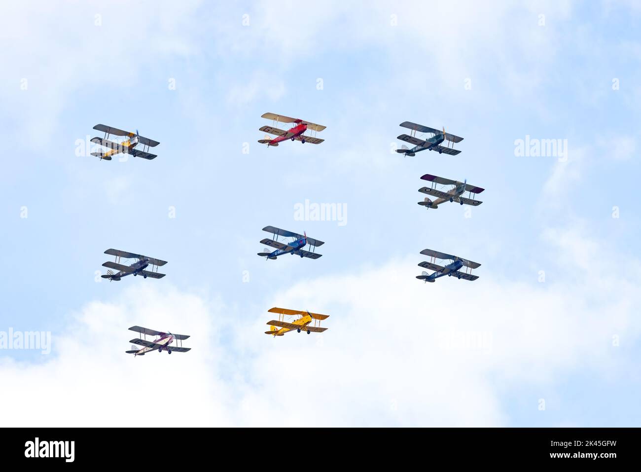 Tiger 9 Aeronautical Display Team, using de Havilland DH82A planes, aka The Tiger Moth, flying over the Imperial War Museum Duxford, 2022 airshow Stock Photo