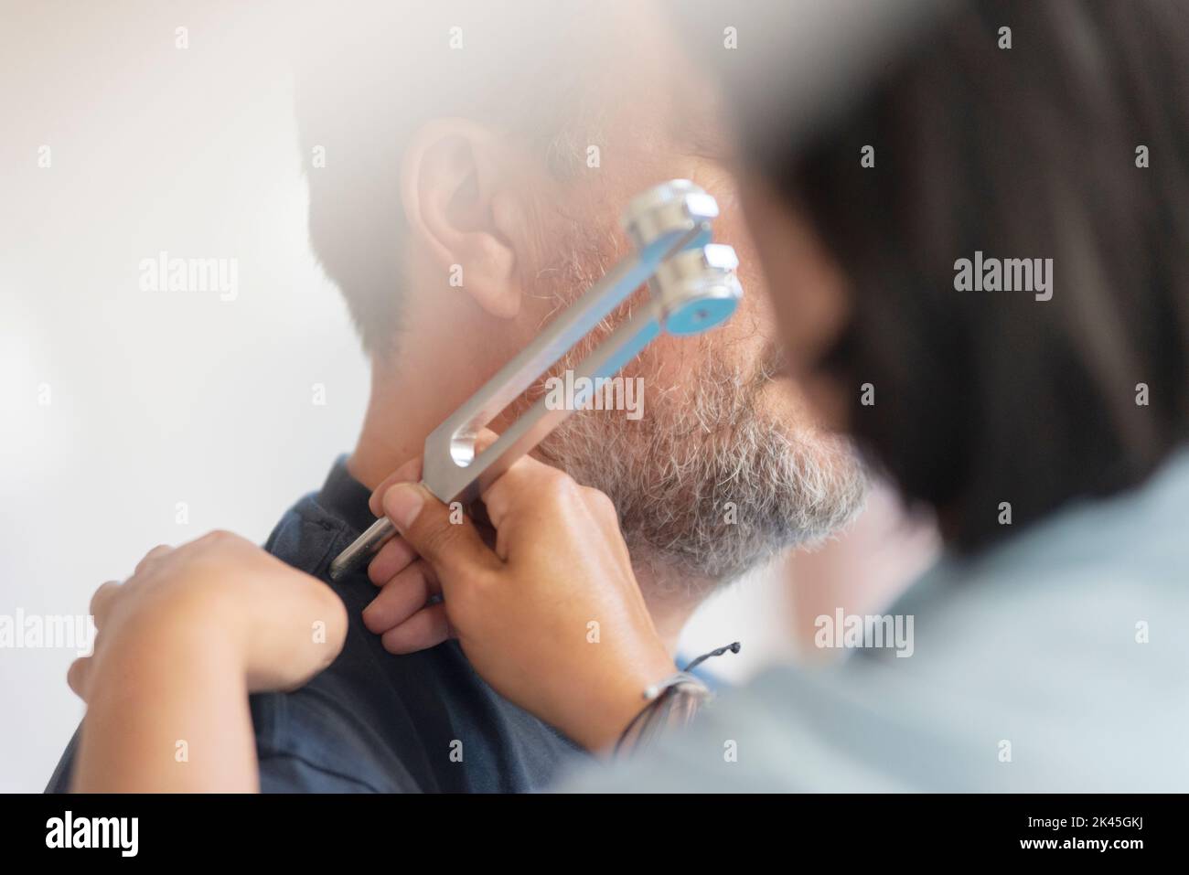 Music Therapist with Tuning Fork Stock Photo
