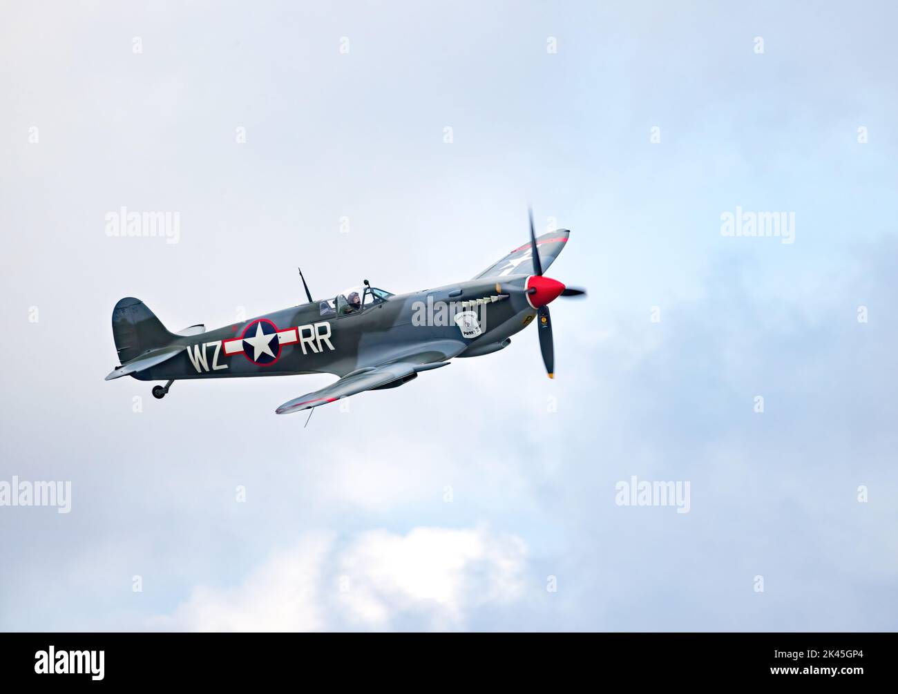 Vintage plane; Spitfire Mk XVI flying in american colours, WW2 fighter plane, Imperial War Museum Duxford Airshow, UK Stock Photo