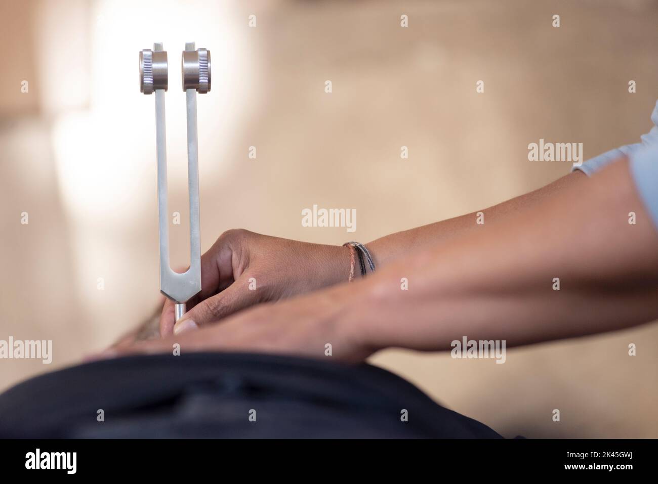 Music Therapist with Tuning Fork Stock Photo