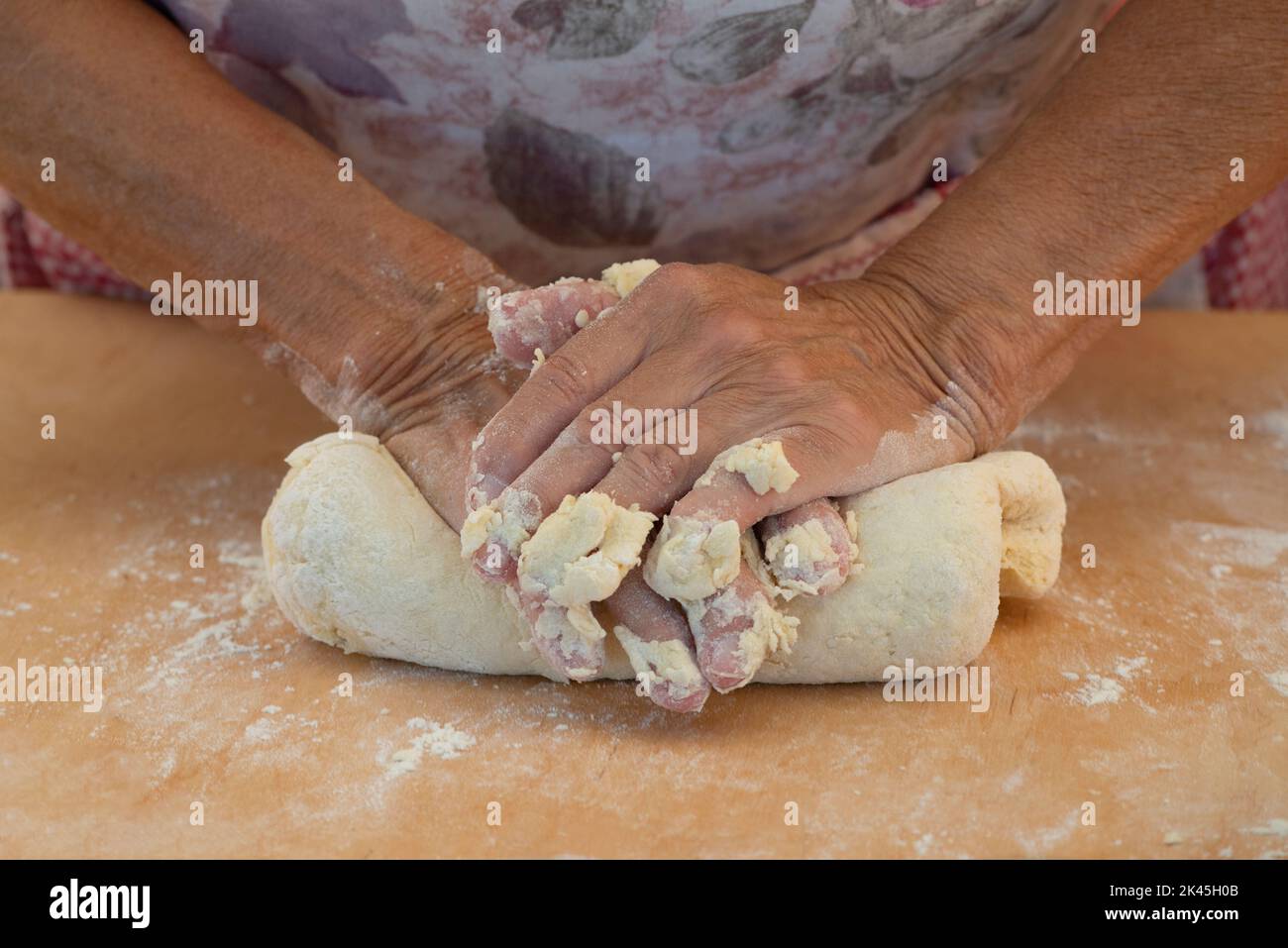 Woman Hands Knead the Dough Stock Photo