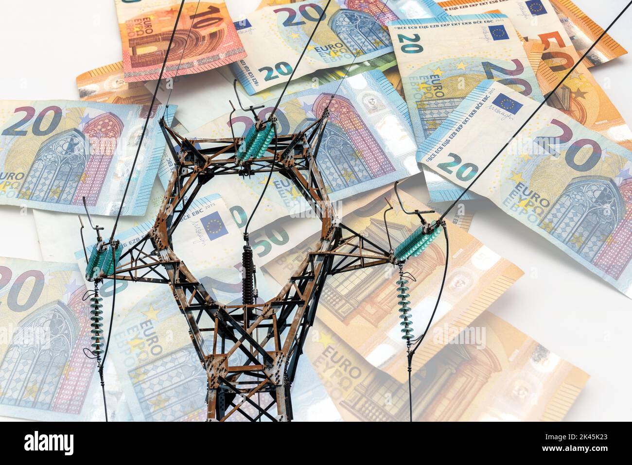 Electric tower and euro money, High-voltage power lines on euro banknotes , energy cost concept, kilowatt hour price increase Stock Photo