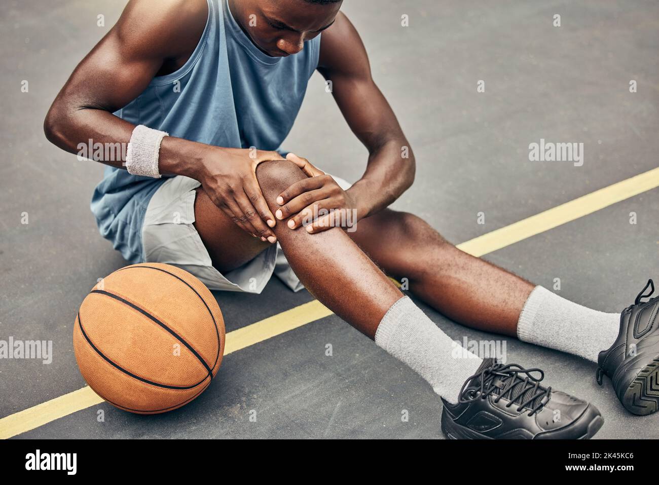 Fitness, basketball knee injury or pain while on basketball court holding leg in exercise