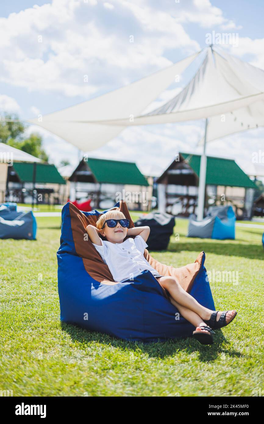 Girl sitting on beanbag chair hi-res stock photography and images - Alamy
