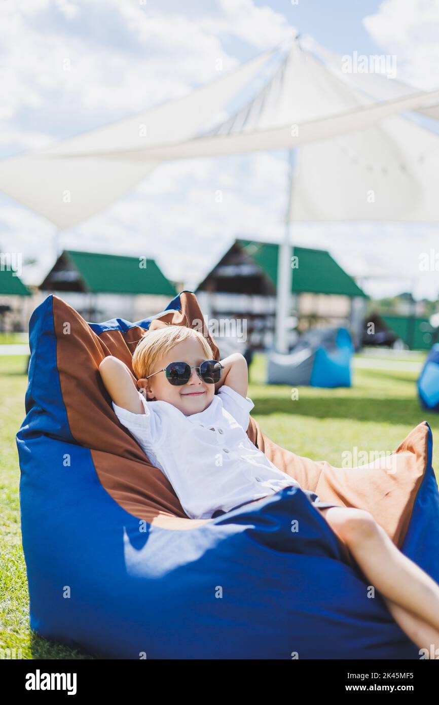 Girl sitting on beanbag chair hi-res stock photography and images - Alamy