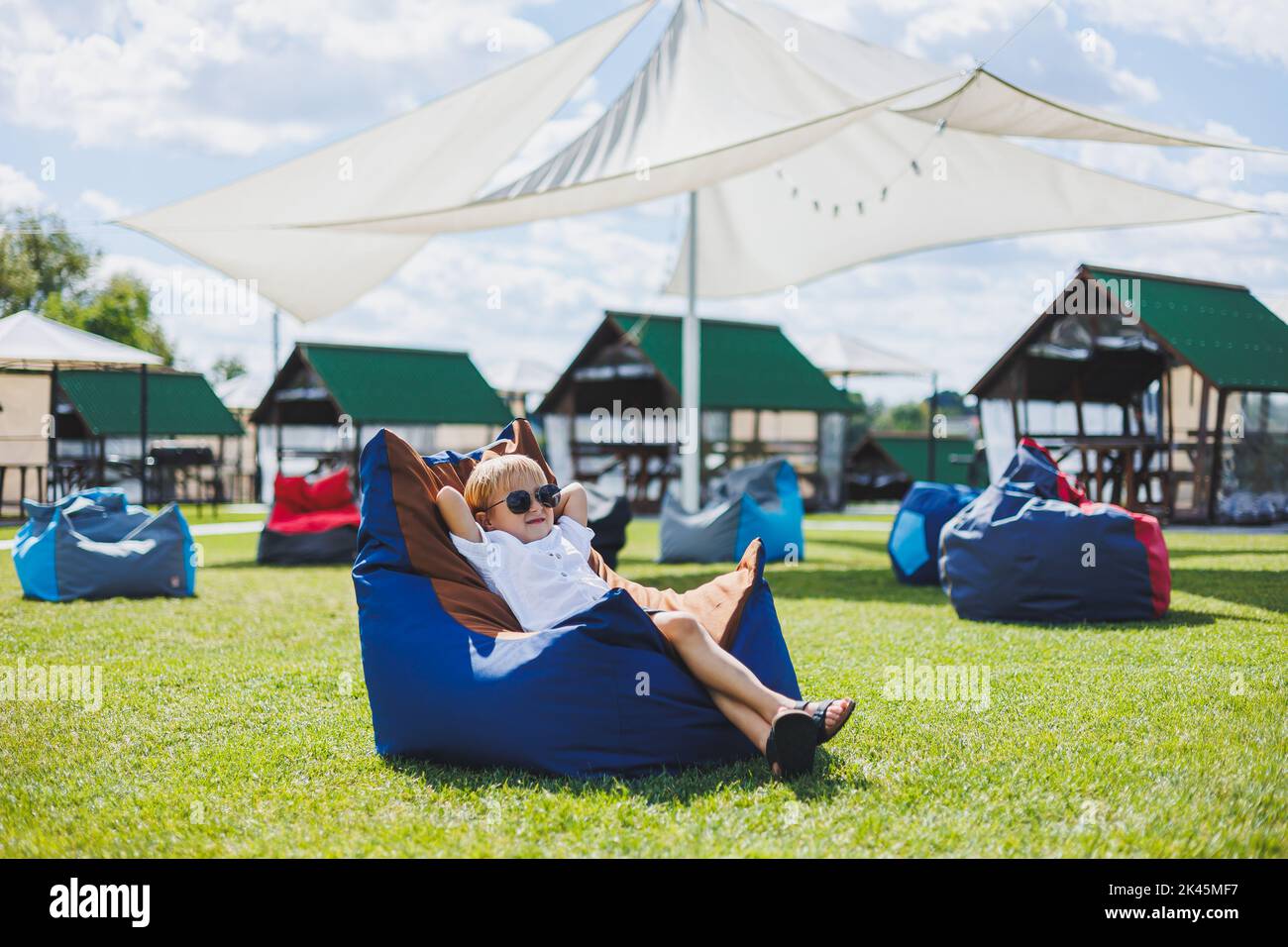 Girl sitting on beanbag chair hi-res stock photography and images - Alamy