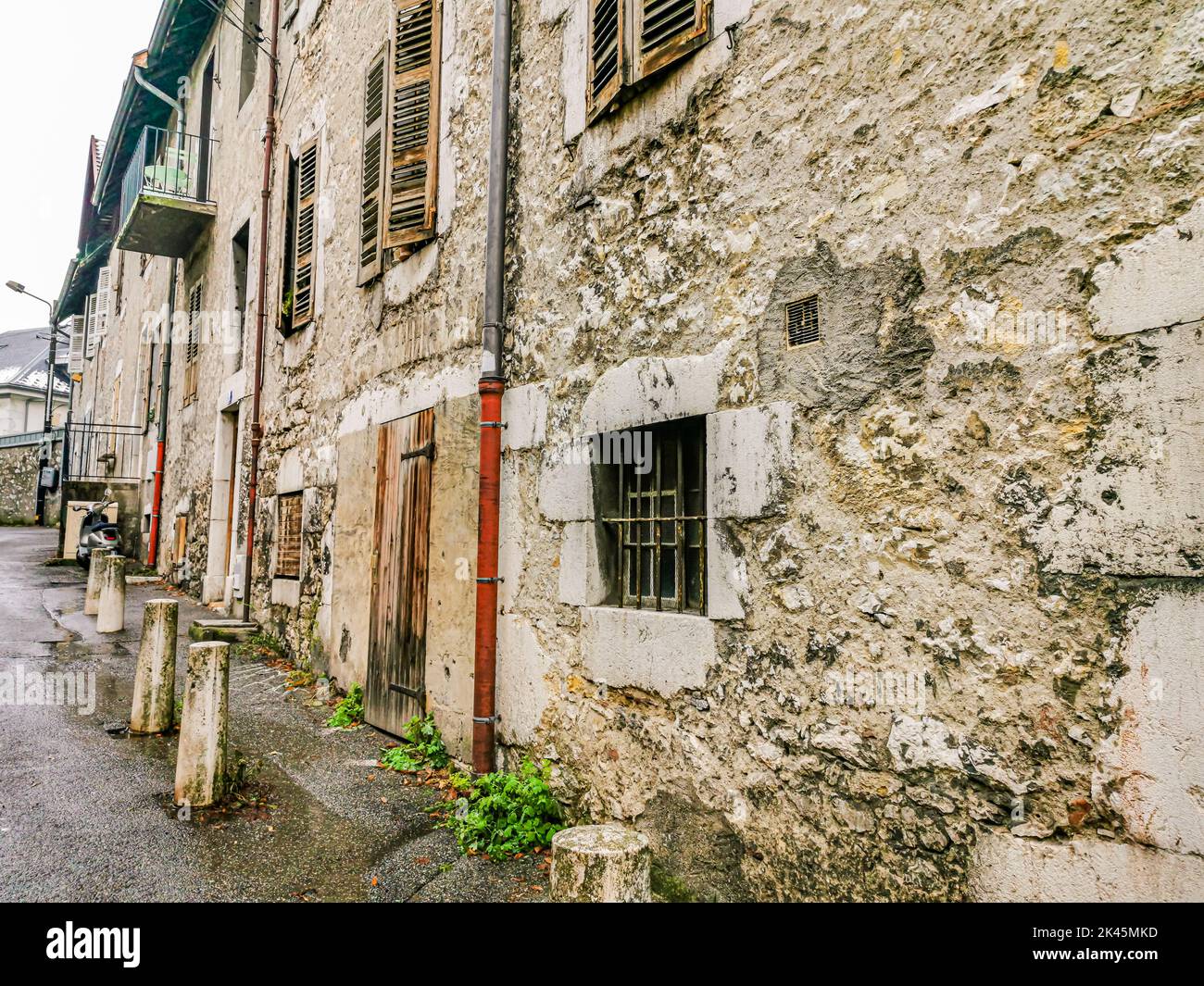 Facade of an old stone house in a small town in the alps Stock Photo ...
