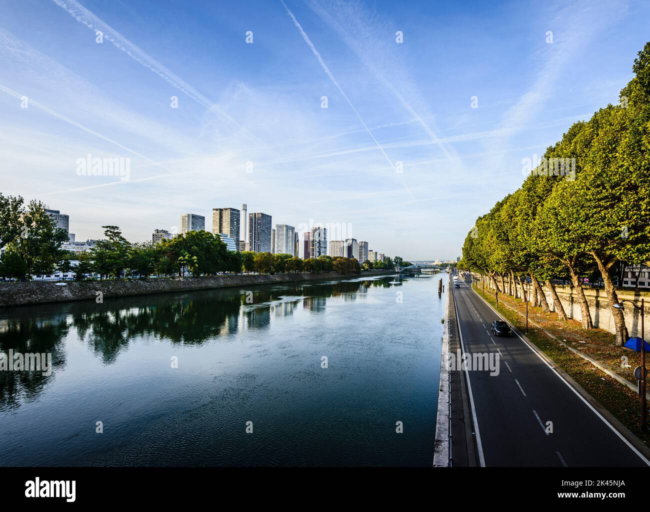 View along the River Seine, a road by the water, high rise buildings. Stock Photo