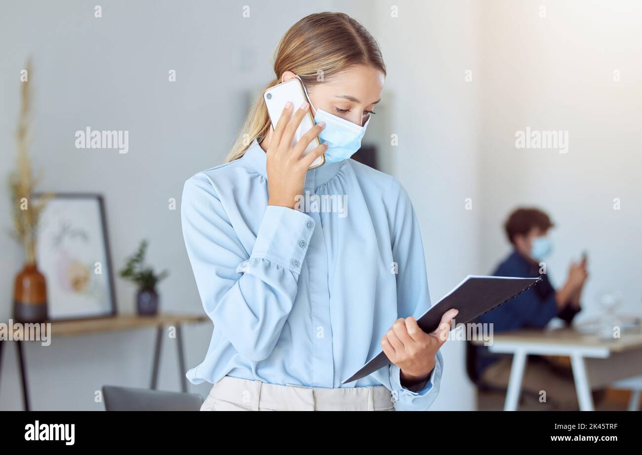Woman, covid face mask or business phone call in marketing office, advertising startup or creative company. Worker or virus compliance employee with Stock Photo